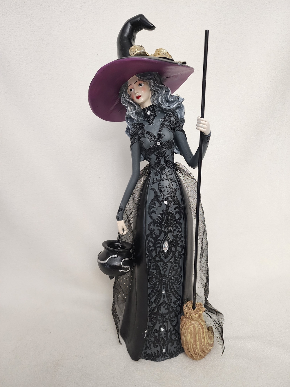 Elegant Black Witch Figurine with Purple Hat - Decorative Home Accent